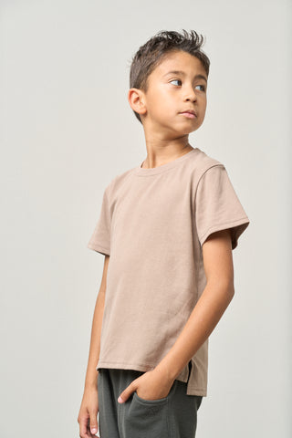 Little Bipsy Elevated Tee - Mushroom
Young boy wearing a beige t-shirt against a plain background
