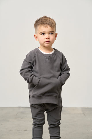 Little Bipsy Pocket Pullover - Shadow
Child wearing a gray outfit against a plain background