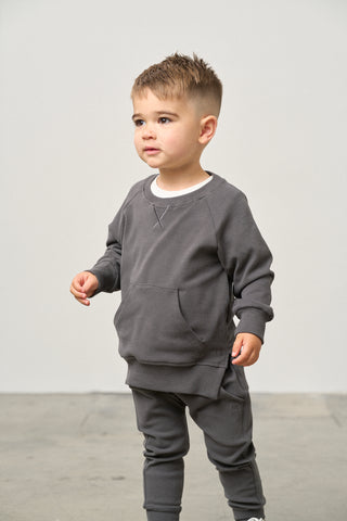 Little Bipsy Pocket Pullover - Shadow
Child wearing a gray outfit standing against a plain background