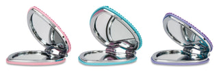 Iscream Heart Rhinestone Compact
Three compact mirrors with colorful rims on a white background