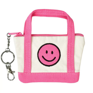 Iscream Mini Tote Bag Lip Balm Key Chain Set
Small bag with a smiley face design and pink handle on a white background