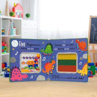 Count and Slide Dinosaurs Board Book
Children's educational book with dinosaur illustrations on a wooden surface