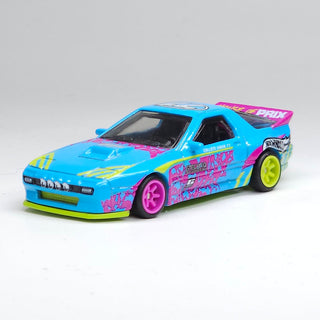 Mattel Hot Wheels Silhouettes Mazda RX-7 FC Pandem Blue
Colorful toy car with pink and yellow accents on a white background