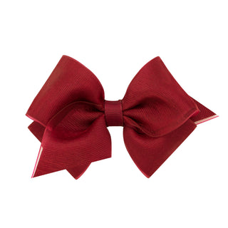 Extra small Wee Ones hair bow with a navy grosgrain overlay clip on clippie, perfect for young children's hairstyles.