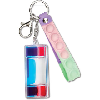 Iscream Water Game Bag Charm
A novelty keychain featuring a clear rectangular container filled with layered blue, white, and red gel, attached to a silver clasp, alongside a pastel purple, pink, and mint green pop-it style silicone keychain loop.