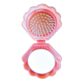 Iscream Mermaid Vibes pop-up shell mirror and hairbrush, open to show the compact shell design and bristles inside.