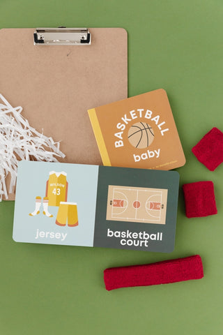 Left Hand Book House basketball-themed board book for babies, featuring colorful illustrations for early learning and development.