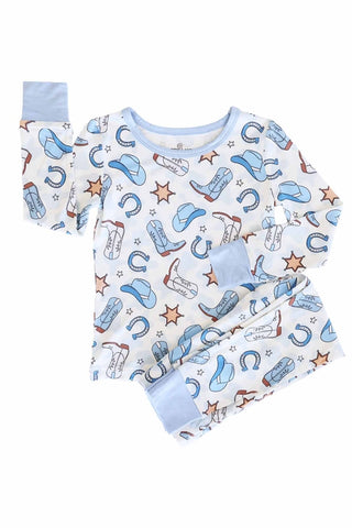 Caden Lane Rodeo Dreams Blue two-piece pajama set for kids, featuring a playful blue and white cowboy print.