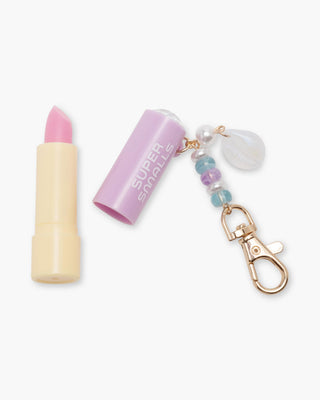 Super Smalls Mermaid Magic Lip Balm Key Chain
Lipstick-shaped keychain with decorative elements on a white background