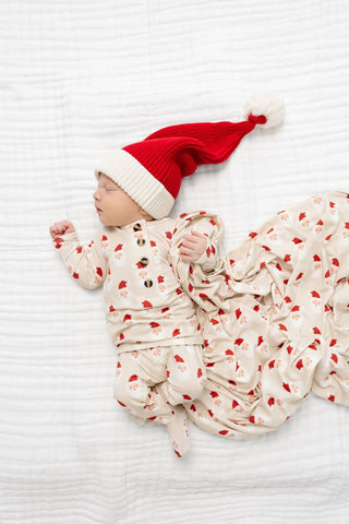 Lou Lou and Company Santa Beanie
Baby wearing a red and white Santa hat on a white blanket