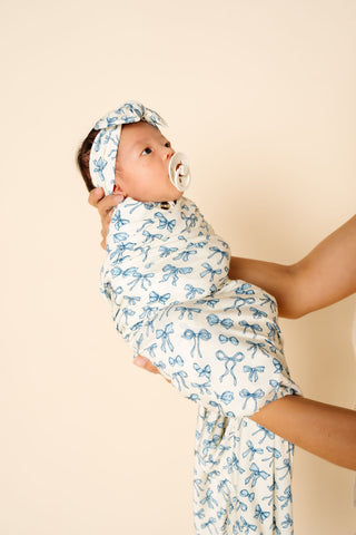 Lou Lou and Company Stella swaddle blanket with soft, cozy fabric and stylish floral pattern for newborns and babies.