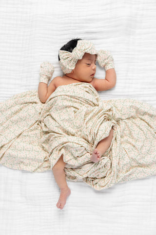 Lou Lou and Company Quincy headband featuring a soft fabric band with playful floral pattern for infants and toddlers.
