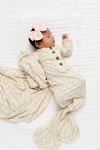 Lou Lou and Company Quincy knotted baby gown with soft fabric and pastel colors, featuring a cute knotted design.