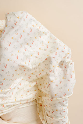 Lou Lou and Company Top and Bottoms - Willow
Folded fabric with small floral pattern on a beige background
