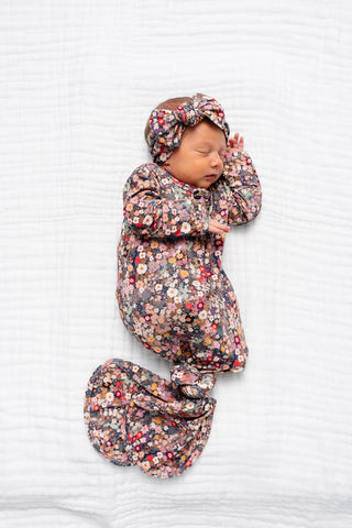 Lou Lou and Company Knotted Gown - Gracie 
Newborn baby in floral outfit and headband on a white background