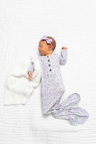 Lou Lou and Company Knotted Gown - Lily
Newborn baby in a floral outfit and matching blanket on a white background