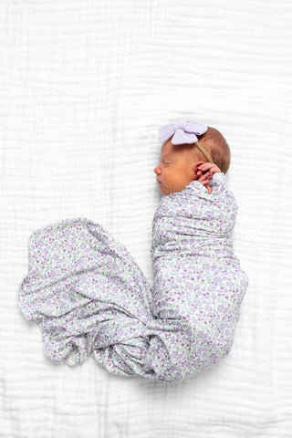 Lou Lou and Company Swaddle Blanket - Lily
Newborn baby swaddled in a floral blanket on a white background