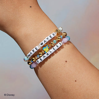 Little Words Project Bracelet - Disney Princess: Ariel
Bracelets with motivational phrases on a wrist against a neutral background