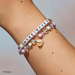 Make Waves Little Words Project Bracelet - Disney Princess: Ariel
Bracelet with 'MAKE WAVES' on a wrist against a neutral background