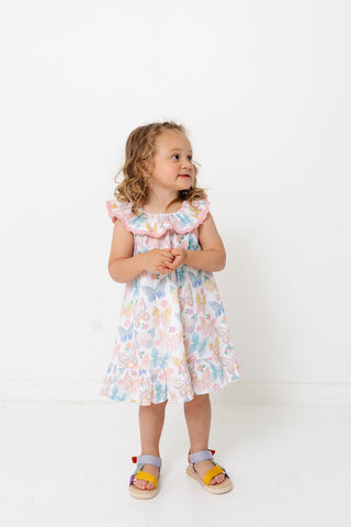 Alto Modas Girls Harper Dress - Butterflies
Young girl wearing a floral dress on a white background