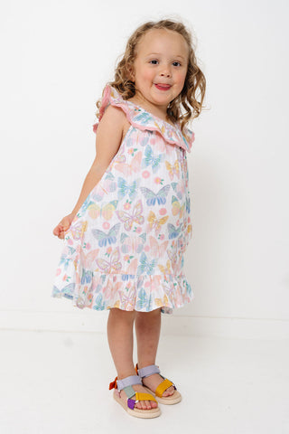 Alto Modas Girls Harper Dress - Butterflies
Young girl wearing a floral dress with colorful sandals on a white background
