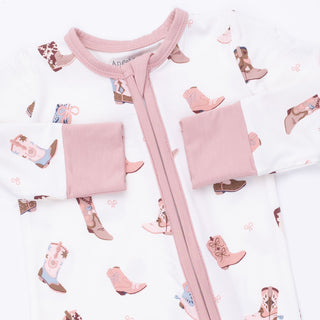 Angel Dear Convertible Romper - Buckarette Boots
Baby outfit with pink romper and pants on a white background with baby booties and blankets.