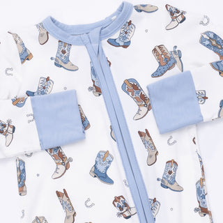 Angel Dear Convertible Romper - Buckaroo Boots
Baby outfit with blue pants and white shirt on a patterned background of cowboy boots and horseshoes.