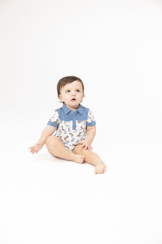Angel Dear Cowboy Shortie - Cowboy Boots
Baby sitting on a white background wearing a patterned outfit with blue accents.