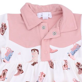 Angel Dear Long Sleeve Cowboy Bodysuit Dress - Buckarette Boots
A close-up of a baby girl's dress featuring a pink collar and button placket, a white ruffled skirt, and an all-over print of cowboy boots in pink, brown, and blue.