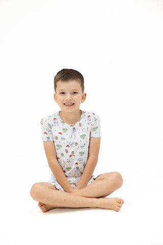 Angel Dear Loungewear Short Set - Home Run Baseball
Child wearing a patterned shirt sitting on a white background
