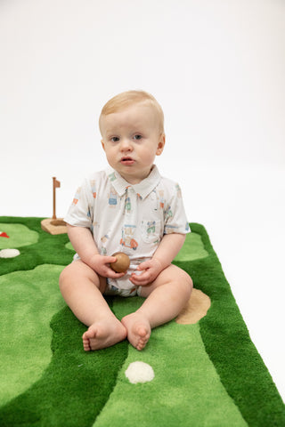 Angel Dear Polo Shortie - Golfing Teddy Bears
Baby sitting on a green play mat with golf course design