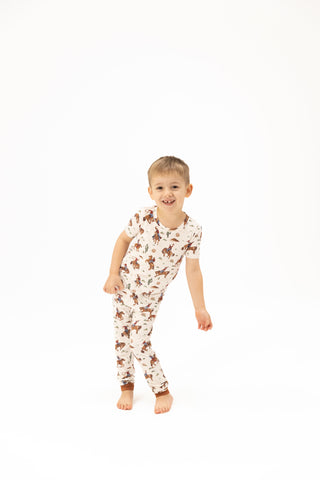Angel Dear Short Sleeve Loungewear Set - Buckaroo Western
Child wearing a cow print onesie on a white background