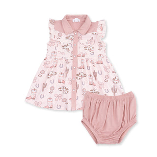 Angel Dear Western Pearl Snap Dress & Bloomer - Cowgirl Boots and Bows
A baby girl's two-piece clothing set featuring a sleeveless pink collared dress with a western-themed print of cowboy boots, cacti, and horseshoes, paired with matching pink ruffled bloomers, displayed on a clean white background.