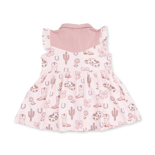 A baby girl's sleeveless dress with a pink Angel Dear Western Pearl Snap Dress & Bloomer - Cowgirl Boots and Bows
western-themed print featuring cowboy boots, cacti, bows, and horseshoes, shown against a plain white background.