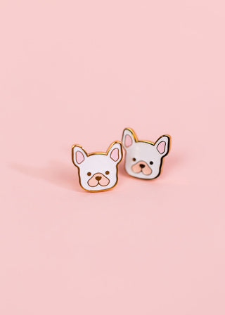 Pierced Co. White Dog Earrings
Two dog-shaped pins on a pink background