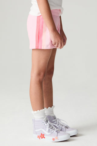 Chaser Multi Stripes Girls Shorts
Person wearing a pink and white skirt with white sneakers on a light gray background
