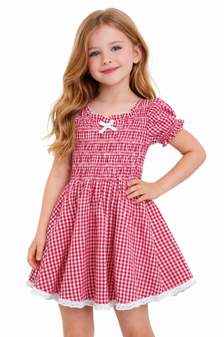 FBZ Red Gingham Puff Sleeve Ruched Dress
Young girl wearing a red and white checkered dress with a bow on a white background