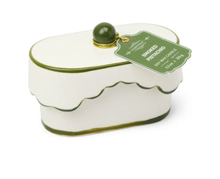 Paddywax Chérie 5.5 oz Ceramic Candle - Smoked Pistachio
White candle shaped like a cake with green accents and a label on a white background