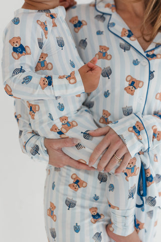 In My Jammers Hanukkah Bears Women's Set
Two people wearing matching pajamas with teddy bear and Hanukkah menorah patterns.