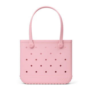 Baby Bogg Bag - Blush-Worthy
A light pink silicone tote bag with a perforated design and double top handles, shown against a plain white background.