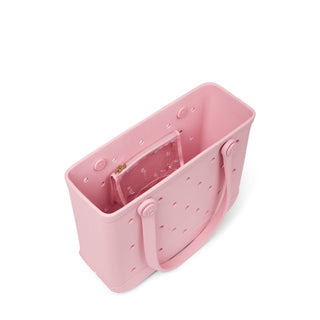 Baby Bogg Bag - Blush-Worthy
A light pink silicone tote bag with a matching clear plastic pouch inside, shown from an elevated angle on a white background.