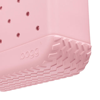 Baby Bogg Bag - Blush-Worthy
Close-up of a pink Bogg product corner showing a textured treaded base and the embossed Bogg logo, on a white background.