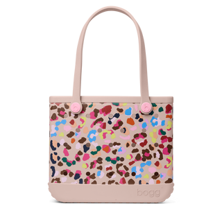 Baby Bogg® Bag - Neon Jungle
Tote bag with colorful pattern and pink handles on a white background