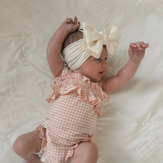 Baby Bling satin FAB headband in oatmeal color, soft and stretchy fabric with a bow detail for infants and toddlers.
