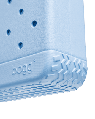 Bitty Bogg® Bag - Blue Skies and Bogg Bag
Close-up of a blue bogg shoe with textured sole and brand logo.