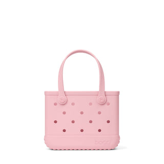 Bitty Bogg® Bag - Blush-Worthy
A light pink Bogg brand tote bag with a perforated design and dual top handles, shown against a plain white background.