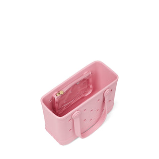 Bitty Bogg® Bag - Blush-Worthy
A pink silicone bag with a clear zippered pouch inside, shown from an elevated angle on a white background.