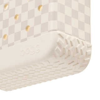 Bitty Bogg® Bag - Checkered: Coconut / Mushroom
Close-up of a Doggo shoe with a beige and white checkerboard pattern on the upper and a thick, textured off-white sole.
