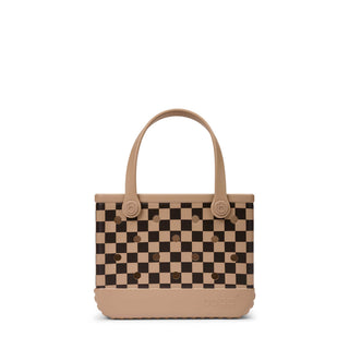 Bitty Bogg® Bag - Checkered: Camel / Hot Cocoa
A small tote bag with a beige and dark brown checkerboard pattern, featuring solid beige handles and base, photographed on a clean white background.