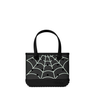 Bitty Bogg® Bag - Itsy Bitsy Glow in the Dark
A black croc-heel tote bag with a white spiderweb pattern on the front, featuring dual top handles and a textured black sole.